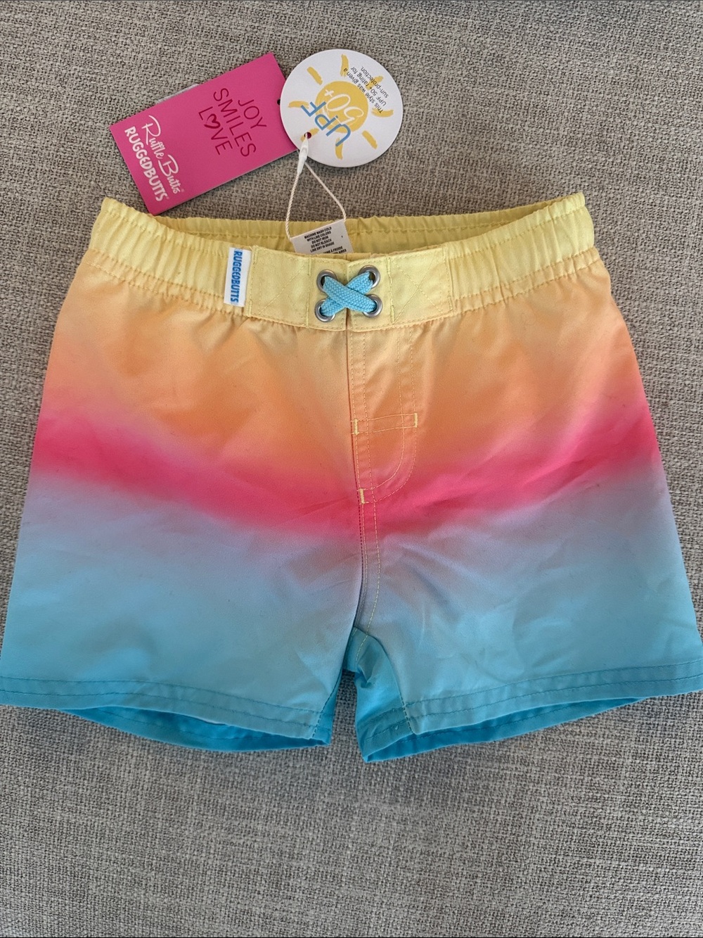 RuggedButts Kids Ombre Swim Trunks in Yellow Pink Blue